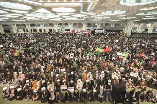 Iranians gather in support of the government at the Imam Khomeini grand mosque in the capital Tehran yesterday.