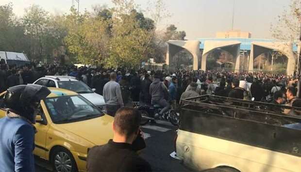 People protest near the university of Tehran, Iran
