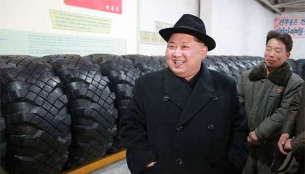 North Korean leader Kim Jong Un visiting the Amnokgang Tyre Factory in Chagang province.