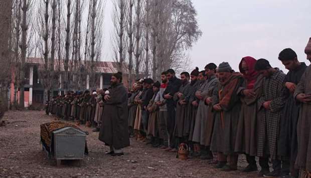 Kashmiri villagers offer funeral prayers to slain Indian paramilitary trooper Sharief-Ud-Din-ganaie at Nagam Chadoora vilage of central Budgam district.