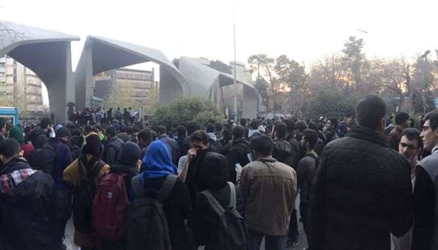 People protest near the University of Tehran, yesterday, in this picture posted on social media.