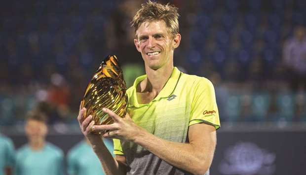 South Africau2019s Kevin Anderson poses with the winneru2019s trophy after winning the Mubadala World Tennis Championship. (AFP)