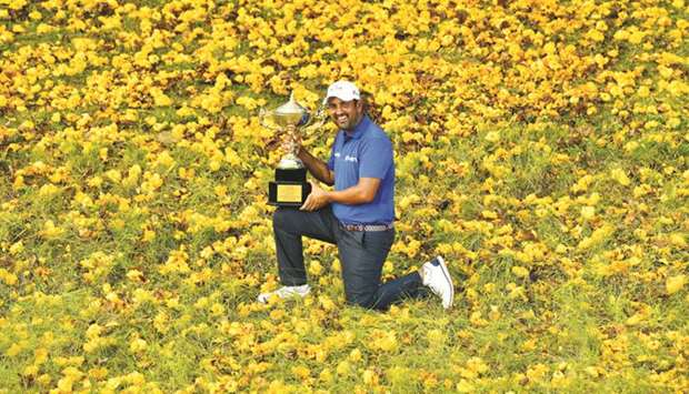 Shiv Kapur of India posing with the winneru2019s trophy after his victory at the Royal Cup at the Phoenix Gold Golf and Country Club in Pattaya. (AFP)