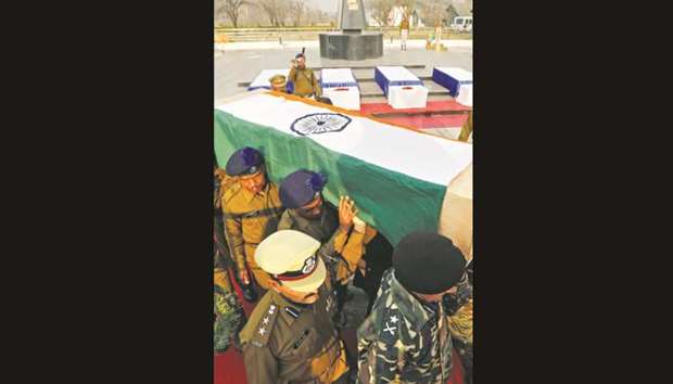 Central Reserve Police Force (CRPF) personnel carry a coffin containing a body of their colleague, who was killed during a gun battle with suspected militants at CRPF training centre in Lethpora in south Kashmiru2019s Pulwama district, yesterday.
