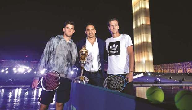 Tournament Director Karim Alami (C) poses with top seed Dominic Thiem of Austria (L) and  third seeded Tomas Berdych of  the Czech Republic ahead of the Qatar ExxonMobil Open.