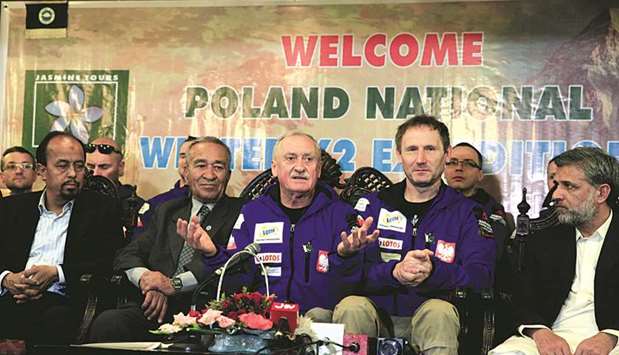 Wielicki (centre), who will run a Polish expedition to scale K2 in winter, speaks during a news conference in Islamabad.