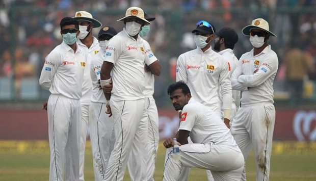 Sri Lanka cricket players wear masks in an attempt to protect themselves from air pollution in Delhi