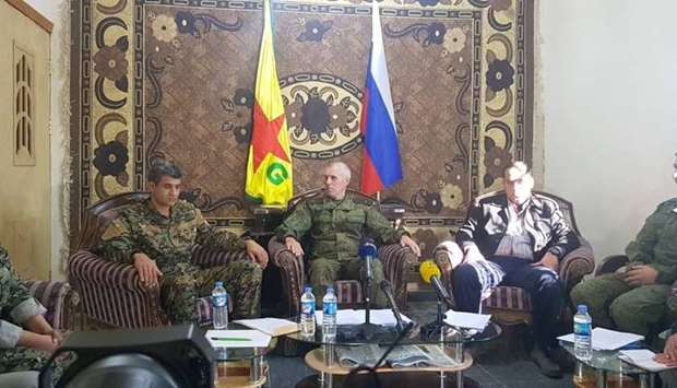 SDF and Russian officials at a joint conference press over the war agains Islamic State group in Deir EzZor