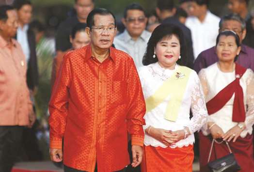 Cambodiau2019s Prime Minister Hun Sen and his wife Bun Rany attend a ceremony at the Angkor Wat temple to pray for peace and stability in Cambodia.