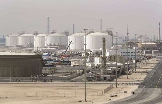 The photo taken on February 6, 2017 shows the Ras Laffan Industrial City, Qataru2019s principal site for production of LNG and gas-to-liquid, some 80km north of Doha. Rising hydrocarbon revenues will cause Qataru2019 budget deficit to narrow in the  quarters ahead despite the upward pressure on spending caused by the ongoing diplomatic crisis in the region,  according to BMI.