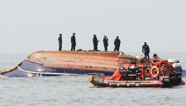 South Korean coastguard searches for missing persons after a fishing boat crashed with a fuel tanker at sea near the western port city of Incheon yesterday.