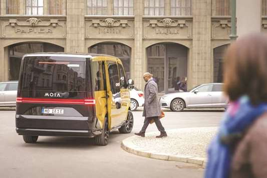 A handout picture obtained from the Volkswagenu2019s new Moia u201cmobility servicesu201d division website shows an all-electric minibus developed to target urban customers who prefer to pay for use rather than own a vehicle. Ole Harms, CEO of Moia, expects services using Moia minibuses to replace 1mn cars across European and US cities by 2025.