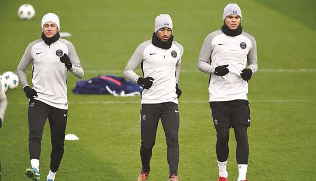 (From left) Paris Saint-Germainu2019s Neymar, Lucas Moura and Thiago Silva take part in a training session in Saint-Germain-en-Laye, western Paris, yesterday on the eve of the UEFA Champions League football match against Bayern Munich. (AFP)