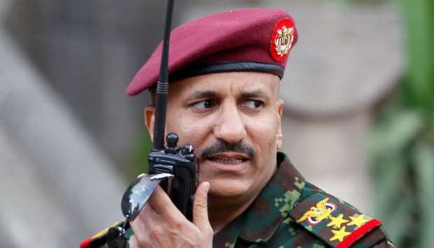 General Tariq Saleh, a nephew of former Yemeni leader Ali Abdullah Saleh, speaks on his walkie-talkie at the Republican Palace in Sanaa, Yemen January 10, 2011