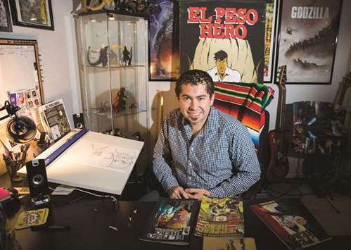 HERO BEHIND THE HEROES: Hector Rodriguez, fifth-grade teacher and creator of the El Peso Hero comic book, poses for a portrait in his studio at his home in McKinney, Texas. El Peso Hero is a comic book series featuring a hispanic Super Man-like hero who fights injustice, border drug cartels, corrupt officials and human trafficking.