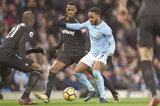 Manchester Cityu2019s Raheem Sterling (right) in action during the English Premier League match against West Ham in Manchester, England, on Sunday. (AFP)