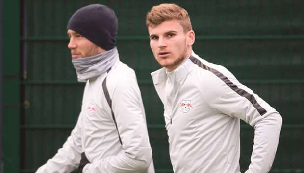 Leipzigu2019s Timo Werner (right) and teammate Konrad Laimer arrive for a training session in Leipzig, Germany, yesterday. (AFP)