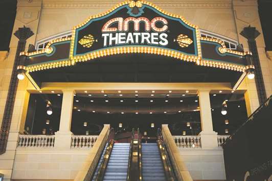 AMC Entertainment Holdingsu2019 signage is displayed outside the entrance to the theatre at the Easton Town Center shopping mall in Columbus, Ohio. The approaches to AMC, along with Cineworld Groupu2019s $3.6bn deal this week to acquire Regal Entertainment Group, show renewed interest in the US theatre market after a bruising year of box-office disappointments and competitive threats.