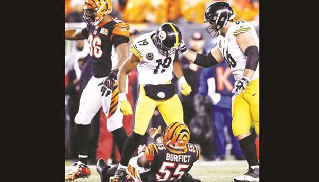Pittsburgh Steelers receiver JuJu Smith-Schuster (centre) was given a suspension after a brutal block on Bengals linebacker Vontaze Burfict, who left the game on a stretcher following the hit.