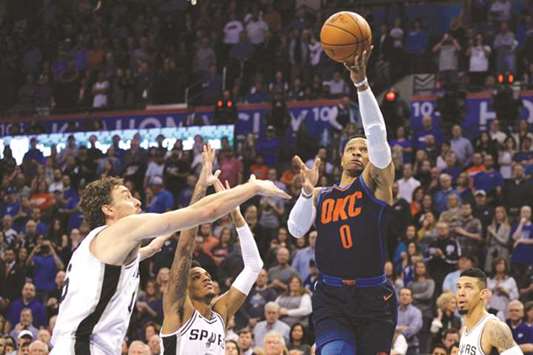 Oklahoma City Thunder guard Russell Westbrook (right) drives to the basket in front of San Antonio Spurs' Pau Gasol (left) and Dejounte Murray during the first quarter. (USA TODAY Sports)