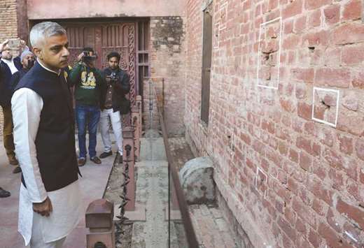 Mayor of London Sadiq Khan looks at the bullet marks on a wall during his visit at Jallianwala Bagh in Amritsar yesterday.