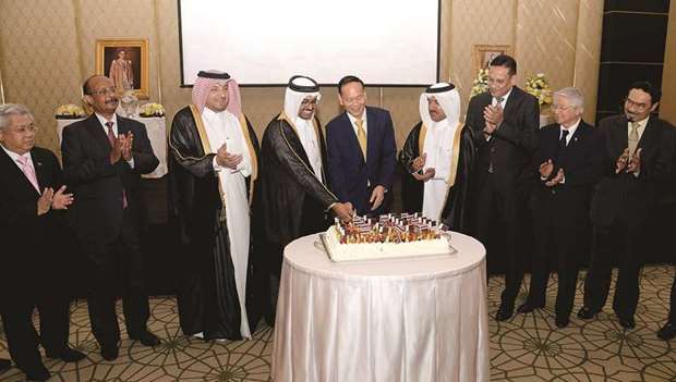 CELEBRATION: HE Dr Mohamed bin Saleh al-Sada, Minister of Energy and Industry; with Dr Ahmed bin Hassan al-Hammadi, the Foreign Ministryu2019s Secretary-General; and Thai ambassador Soonthorn Chaiyindeepum as Ibrahim Yousif Abdullah Fakhro, Ministry of Foreign Affairsu2019 Chief of Protocol, and other diplomats look on. Photos by Thajudheen