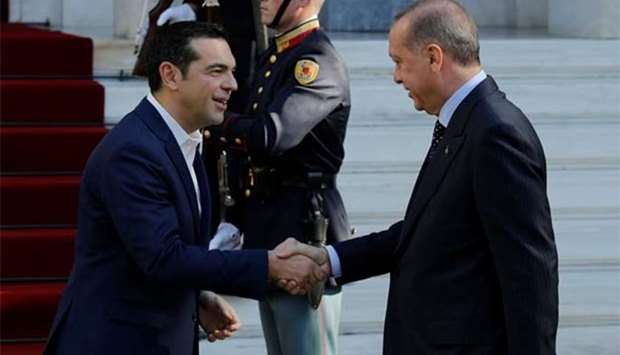 Greek Prime Minister Alexis Tsipras welcomes Turkish President Tayyip Erdogan at the Maximos Mansion in Athens on Thursday.