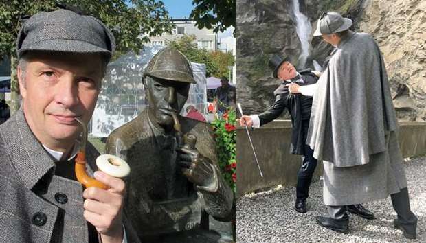 DRESSED UP: Olaf Maurer, president of the German Sherlock Holmes society, poses in Switzerland. Right: REENACTMENT: Sherlock fans Olaf Maurer and Uwe Roeder act out a classic scene in Switzerland from Arthur Conan Doyleu2019s cult novels and short stories.