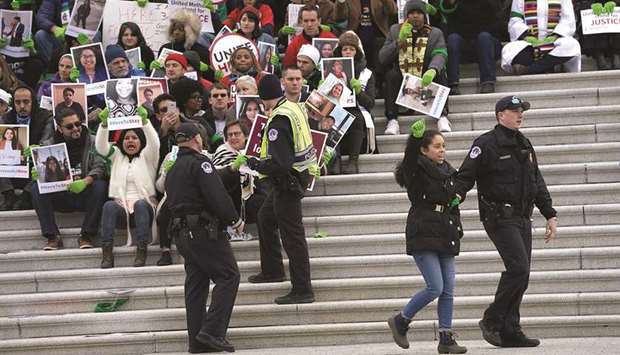 An immigration activist is arrested at the Capitol in Washington, DC.