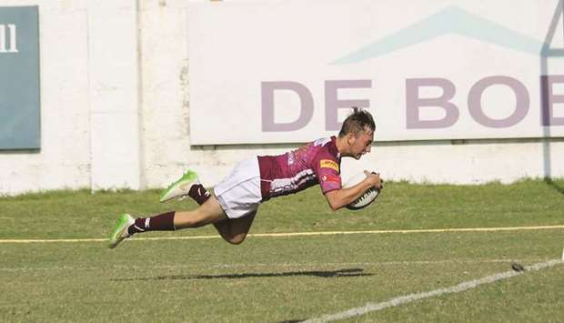 Doha Maroonu2019s James Phillips scores a try during a QRF National Club Rugby Championship earlier in the season.