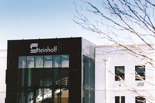 A Steinhoff International logo sits on display outside the companyu2019s offices in Stellenbosch, South Africa (file). Steinhoffu2019s total exposure to lenders and other creditors was almost u20ac18bn ($21bn) as of the end of March.