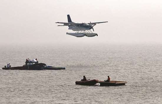 An amphibious seaplane from Japanu2019s Setouchi Holdings prepares to land in the Arabian Sea as part of a demonstration by SpiceJet in Mumbai yesterday.