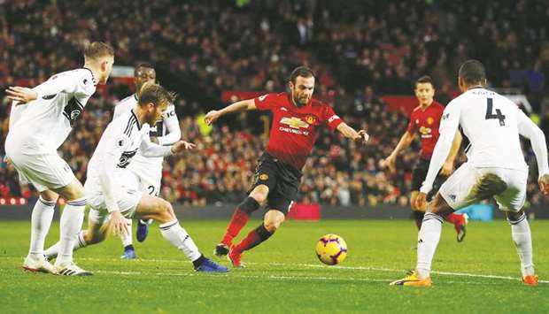 Manchester Unitedu2019s Juan Mata (centre) in action against Fulham during the Premier League match at Old Trafford in Manchester on Saturday. (Reuters)