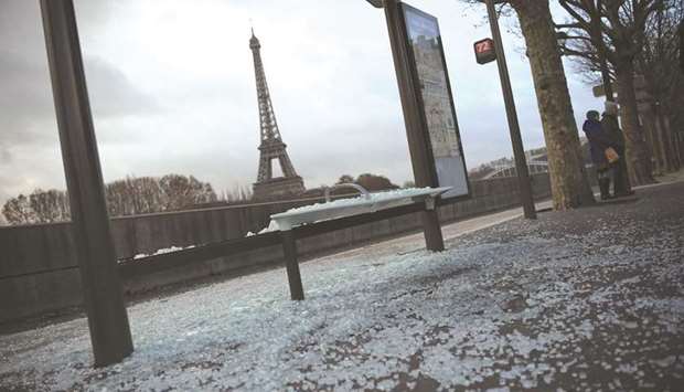 A picture taken in Paris yesterday shows a vandalised bus stop not far from the iconic Eiffel Tower.