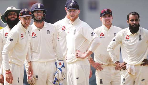 (From left) In this November 26, 2018, picture, Englandu2019s Moeen Ali, captain Joe Root, Ben Foakes, Ben Stokes and Rory Burns watch the run out of Sri Lankau2019s Kusal Mendis (not pictured) on a screen during the third Test in Colombo. (Reuters)