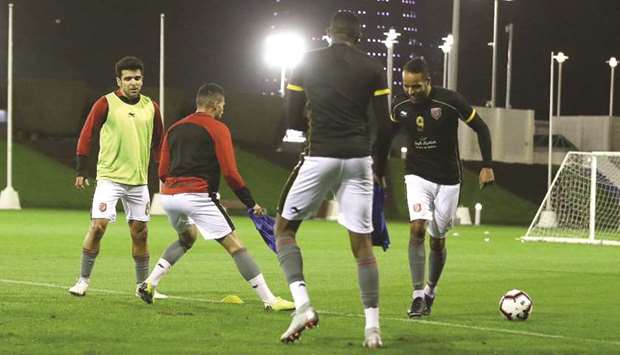 Al Duhail striker Youssef El Arabi (right) trains with his teammates yesterday.