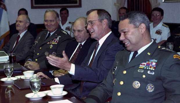 US President George H.W. Bush meets with his military advisors at the Pentagon to discuss the Gulf crisis, in Washington August 15, 1990. From L-R: General Norman Schwarzkopf, chief of Middle East forces, Defense Secretary Dick Cheney and Chairman of the Joint Chiefs of Staff General Colin Powell.