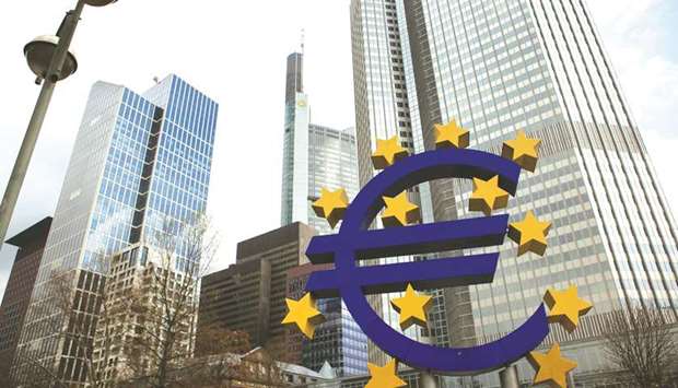 The stars of European Union (EU) membership sit on a euro sign sculpture outside the headquarters of the ECB in Frankfurt. After more than three years and purchases of u20ac2.6tn ($3.0tn) of government and corporate bonds, the ECB should announce as planned tomorrow the end of its u201cquantitative easingu201d programme, after months of step-wise winding-down.