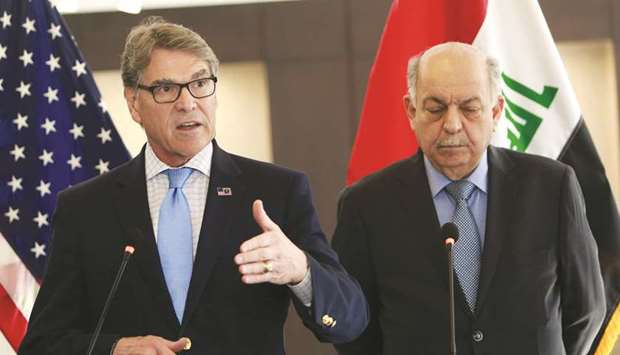 Iraqu2019s Minister of Oil Thamir al-Ghadhban (right) speaks during a joint press conference with US Energy Secretary Rick Perry in the Iraqi capital of Baghdad yesterday. Washington gave Iraq a 45-day waiver over imports of Iranian gas when it reimposed sanctions on Iranu2019s oil sector on November 5.
