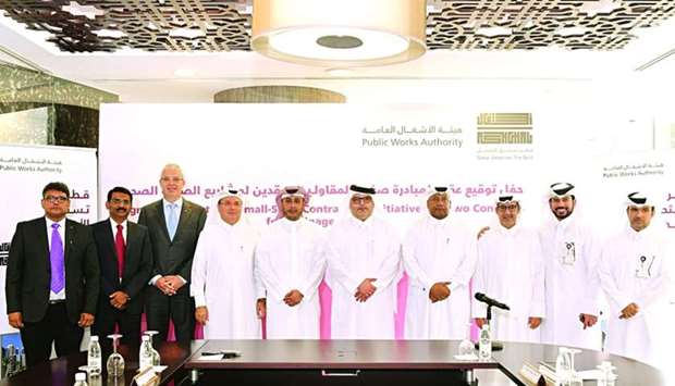 Ashghal president engineer Saad bin Ahmad al-Muhannadi and other officials with representatives of the companies concerned at the contracts signing ceremony.