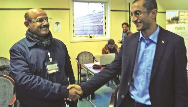 Houthi representative Salim al-Moughaless (right) and Yemeni economist and government representative Ahmed Ghaleb shake hands during the first Yemen peace talks since 2016, yesterday in the Swedish rural town of Rimbo.