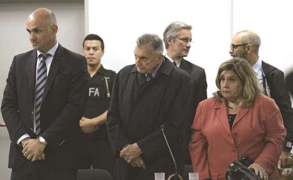 Fordu2019s former executive Hector Sibilla (centre) is pictured before being sentenced for collaborating in the military dictatorshipu2019s u201cdirty waru201d against leftist dissent, in court in San Martin, Buenos Aires, yesterday.