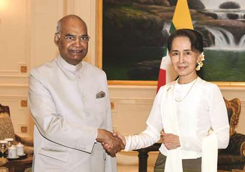 Myanmar State Counsellor Aung San Suu Kyi greets President Ram Nath Kovind in Naypyidaw yesterday.