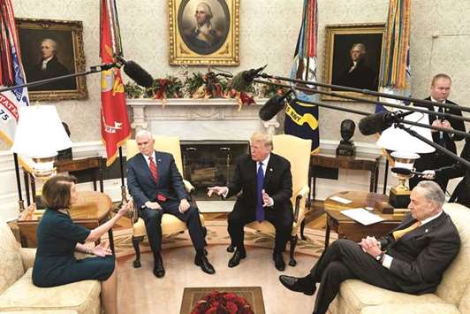Trump and Pelosi argue while Vice President Pence and Senate Minority Leader Schumer listen at the White House yesterday.