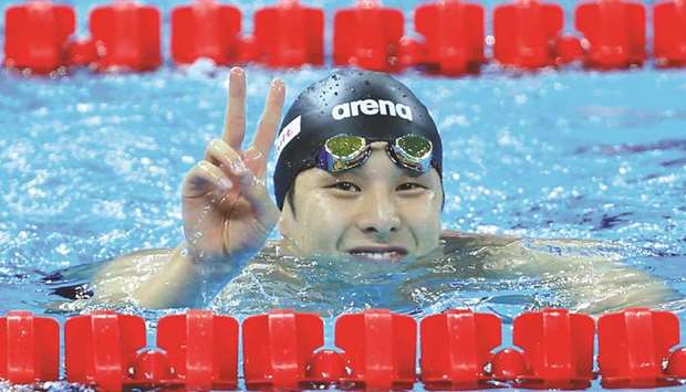 Daiya Seto of Japan celebrates after winning the 200m Butterfly race of 14th FINA World Swimming Championships (25m) in Hangzhou. (Reuters)
