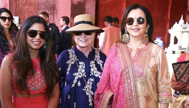 Former US Secretary of State Hillary Clinton poses with Isha Ambani daughter of Mukesh Ambani, Chairman of Reliance Industries, and his wife Nita Ambani at Swadesh Bazaar, a curated showcase of traditional Indian crafts and art forms, in Udaipur
