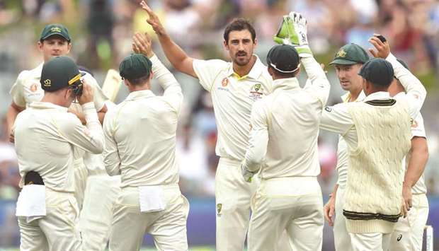 Australiau2019s fast bowler Mitchell Starc (centre) received some criticism for some wayward spells, including a string of costly byes, in Indiau2019s second innings in Adelaide. (AFP)
