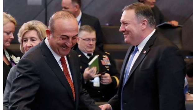 Turkish Foreign Minister Mevlut Cavusoglu and US Secretary of State Mike Pompeo attend the meeting of NATO foreign ministers at the Alliance's headquarters in Brussels, Belgium on December 4.