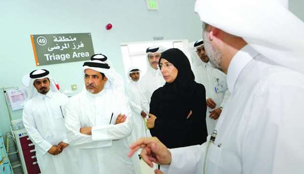 HE the Minister of Public Health Dr Hanan Mohammad al-Kuwari tours the new health centre with senior officials after the inauguration.