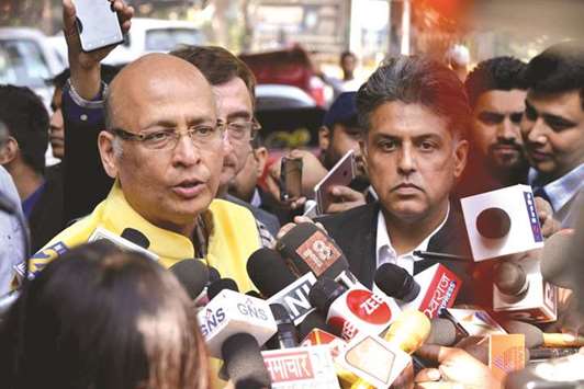 Congress leaders Abhishek Manu Singhvi and Manish Tewari speak to the media after meeting the Election Commission in New Delhi yesterday.
